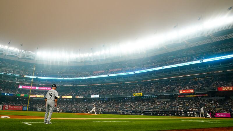 New York Yankees' Clarke Schmidt pitches to Chicago White Sox's Tim Anderson during the first...