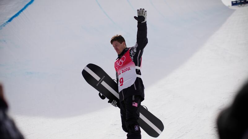 United States' Shaun White waves in the halfpipe course after the men's halfpipe finals at the...
