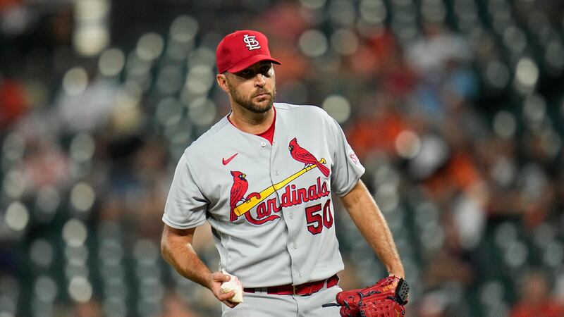St. Louis Cardinals starting pitcher Adam Wainwright looks on between pitches against the...