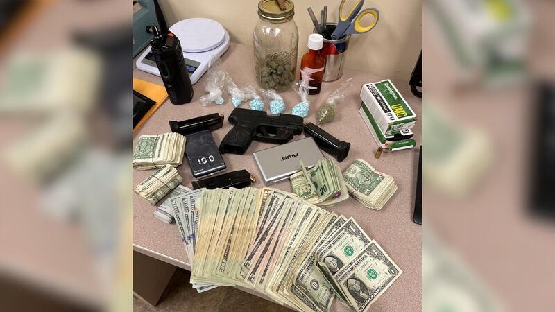 During the search, officers seized 334 blue fentanyl pills along with marijuana, cash, and a gun.
