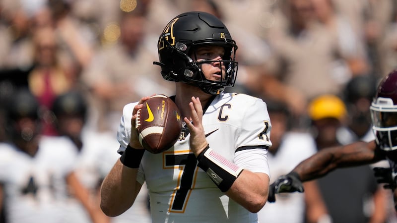 Appalachian State quarterback Chase Brice (7) looks to pass against Texas A&M during the first...