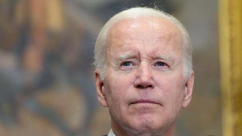 President Joe Biden listens to a reporter's question as he speaks in the Roosevelt Room of the...