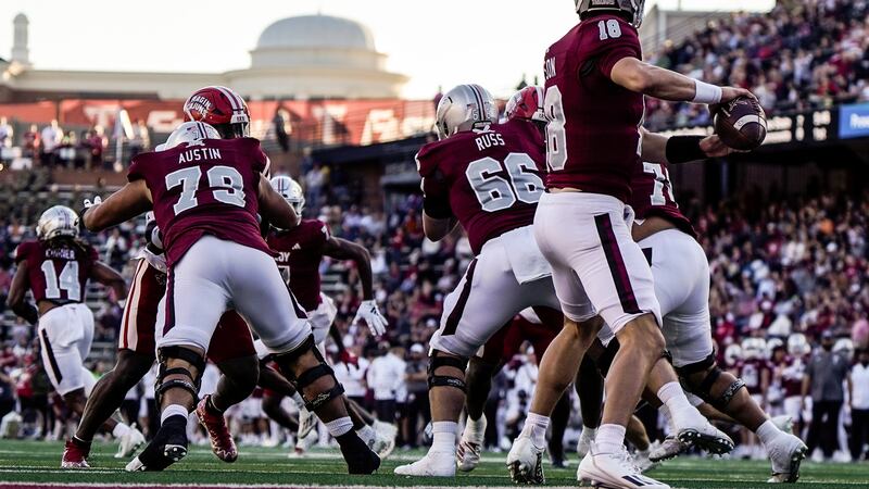 Troy quarterback Gunnar Watson (18) works in the pocket against the Louisiana-Lafayette during...