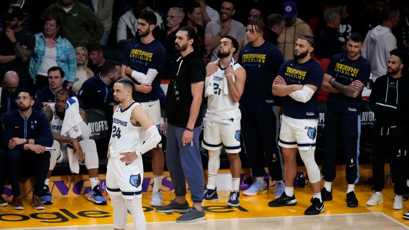 Memphis Grizzlies' Dillon Brooks (24) and the team's bench watch the action during overtime in...