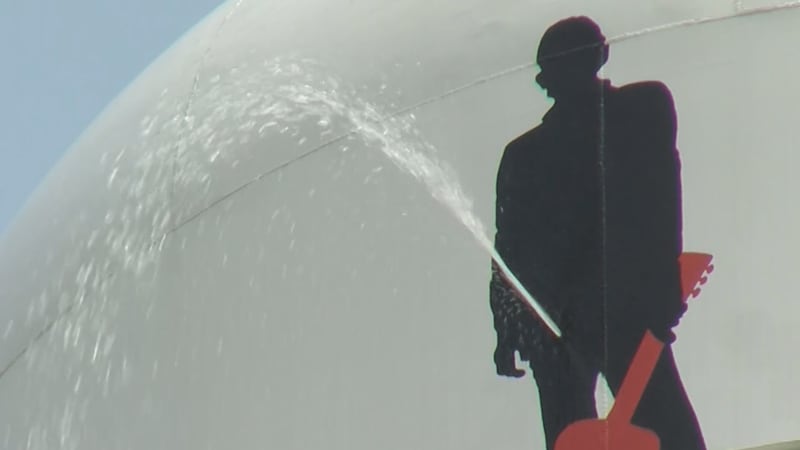 A silhouette of Cash was put up on the 50,000-gallon tank to remember the artist, complete...