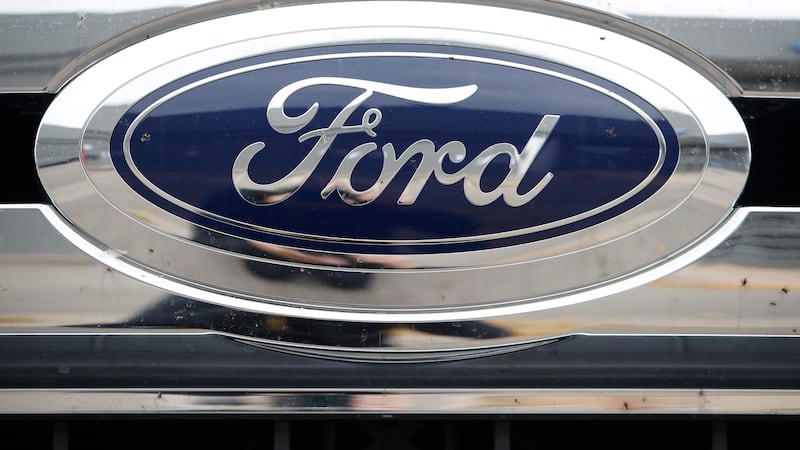 FILE - The Ford company logo is pictured, Oct. 20, 2019, at a Ford dealership in Littleton,...