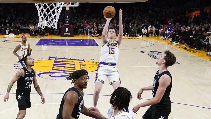 Los Angeles Lakers' Austin Reaves (15) shoots against the Orlando Magic during the second half...