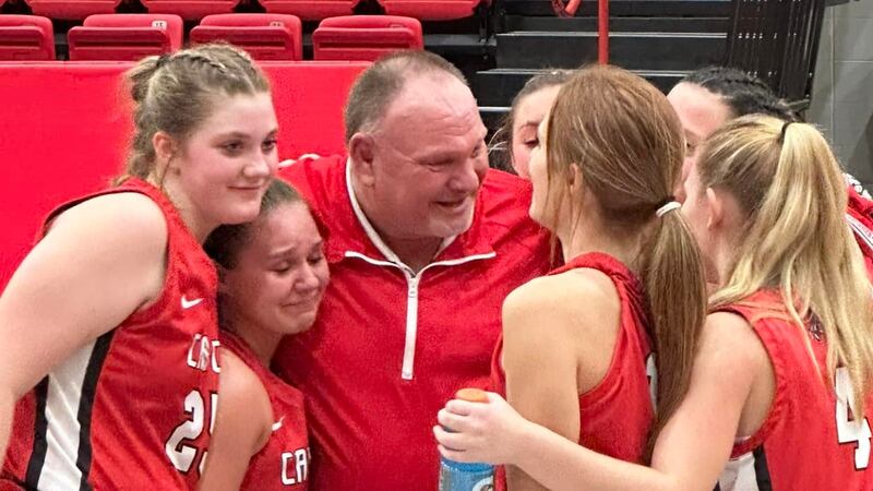 Cave City girls basketball coach Russell Fowler celebrates after winning his 1,000th career game.