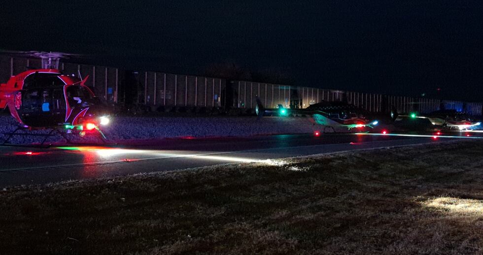 Two people were flown to the hospital Monday after a train crashed into a car south of Osceola.