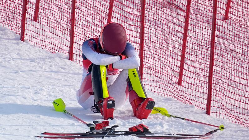 Mikaela Shiffrin, of the United States sits on the side of the course after skiing out in the...