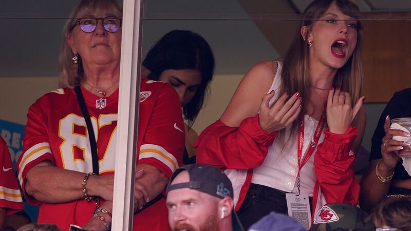 File - Taylor Swift, right, watches from a suite alongside Travis Kelce's mother, Donna Kelce,...