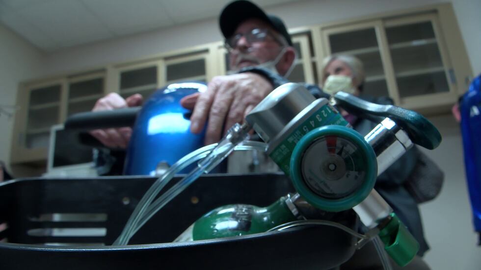 75-year-old Michael Gafford sits with his oxygen tank inside the Lt. Col. Luke Weathers, Jr....